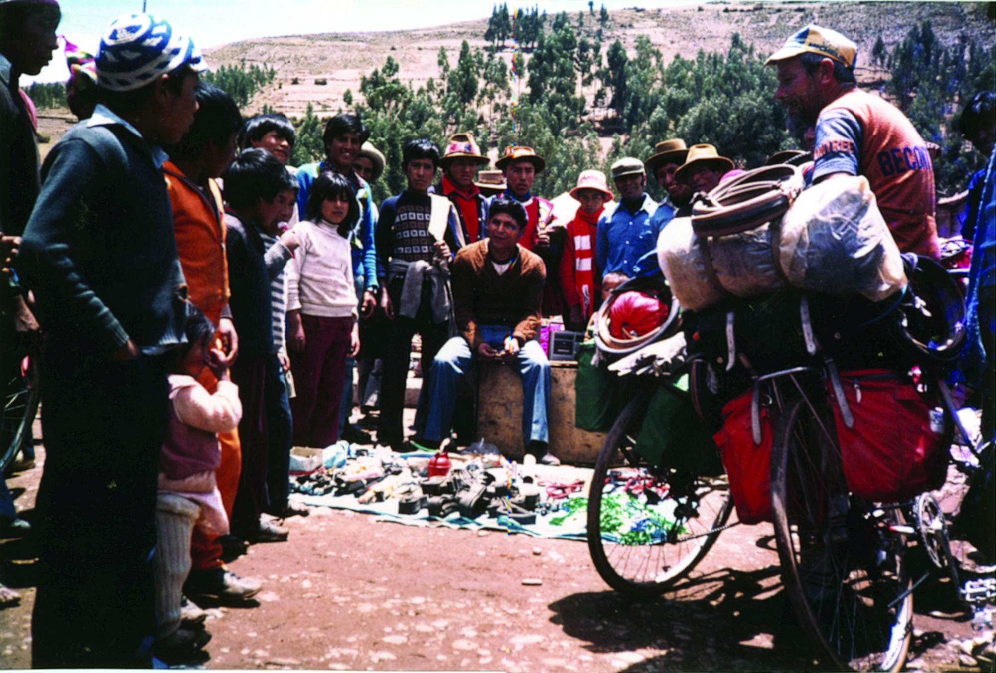Sicuani market place. Bike parts for sale and once again the customer has attracted attention from the locals. Day 22